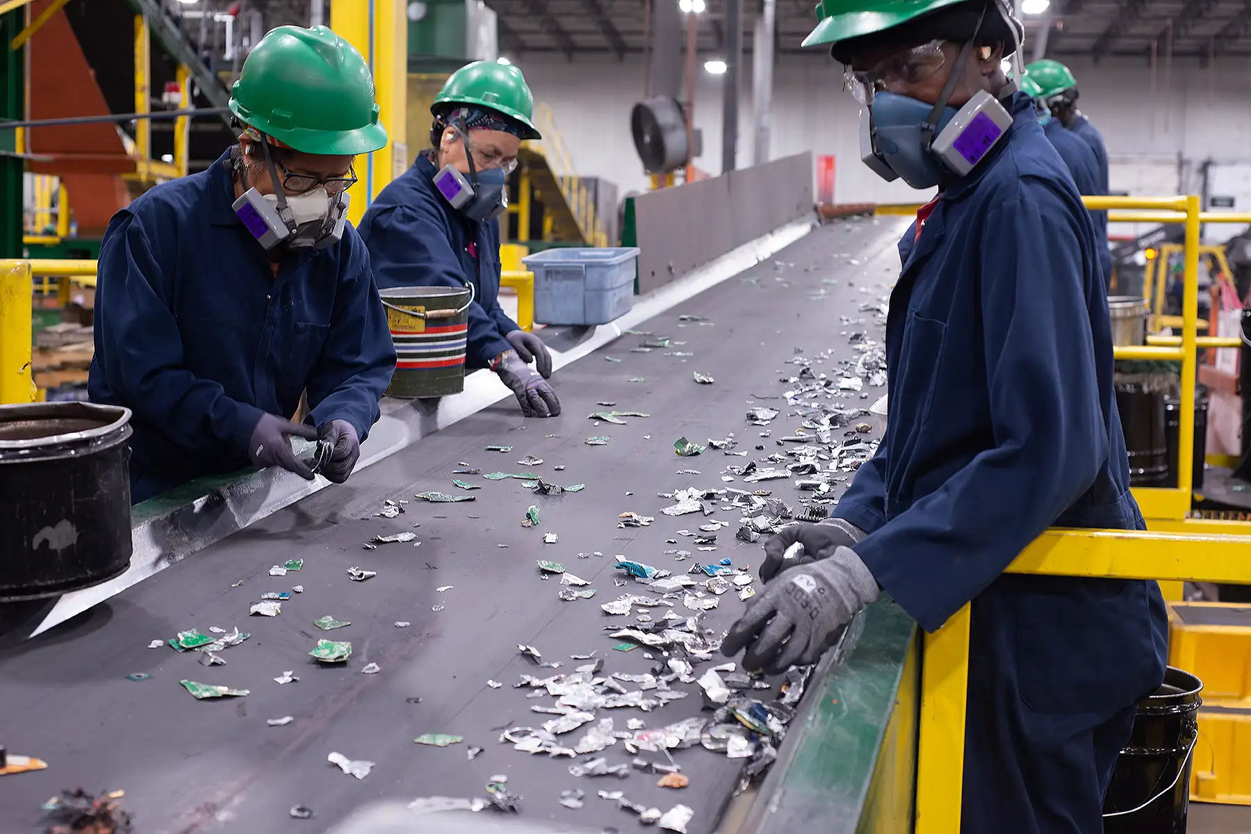 ERI employees sorting shredded material